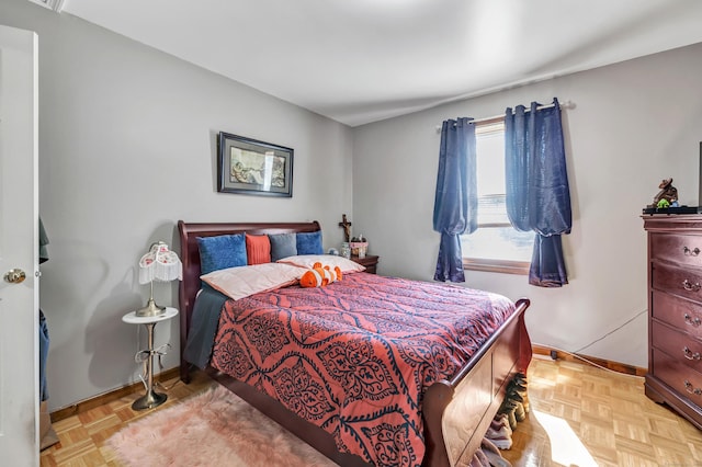 bedroom featuring baseboards