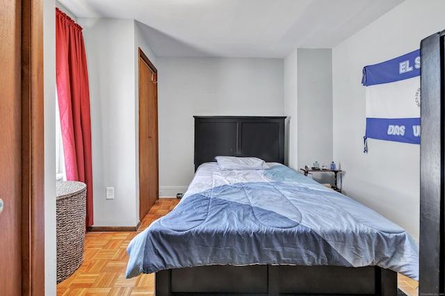 bedroom featuring baseboards