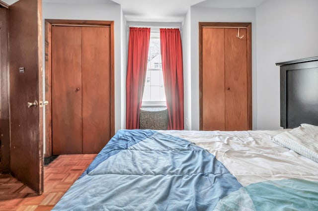 bedroom featuring multiple closets