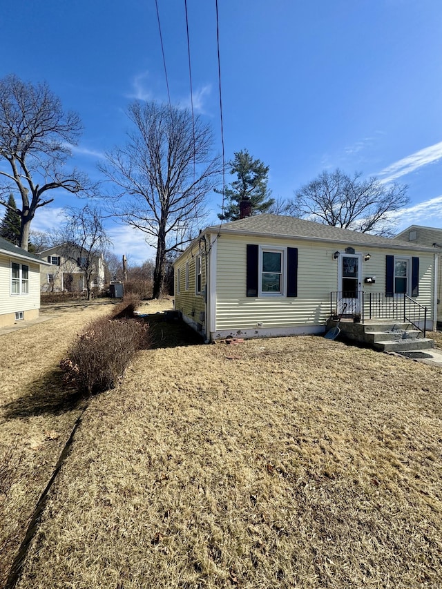 view of side of home with a chimney