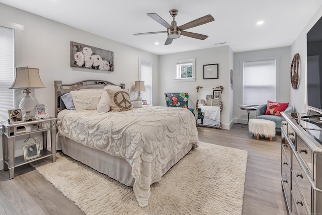 bedroom with recessed lighting, wood finished floors, and a ceiling fan