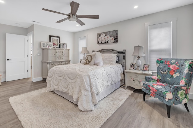 bedroom featuring visible vents, recessed lighting, ceiling fan, and wood finished floors