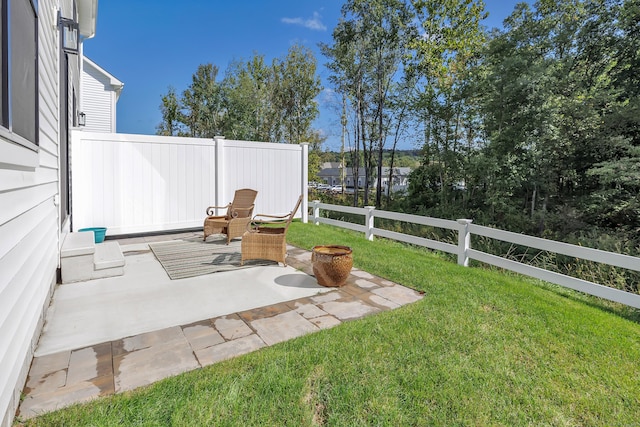 view of yard with a patio and fence