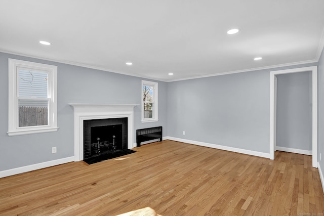 unfurnished living room with recessed lighting, baseboards, light wood-type flooring, and ornamental molding