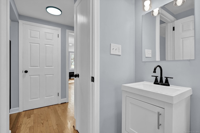 bathroom with vanity and wood finished floors