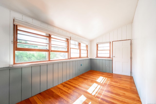 unfurnished sunroom with lofted ceiling and a wealth of natural light