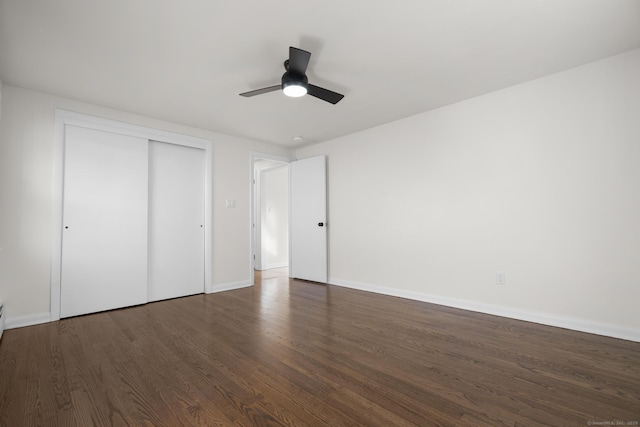 unfurnished bedroom with ceiling fan, a closet, baseboards, and wood finished floors