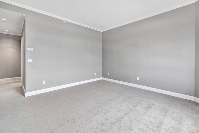 carpeted empty room featuring recessed lighting, baseboards, and ornamental molding