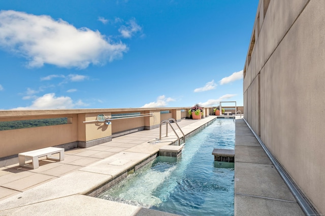 community pool with a patio area