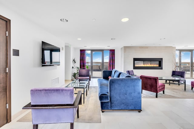 living room featuring recessed lighting, visible vents, and a fireplace