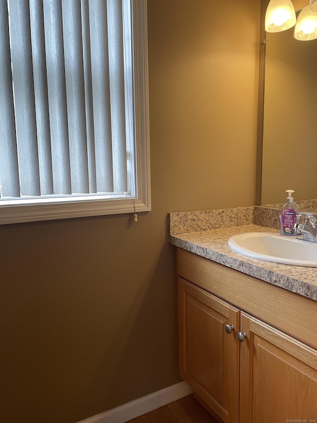 bathroom featuring vanity and baseboards