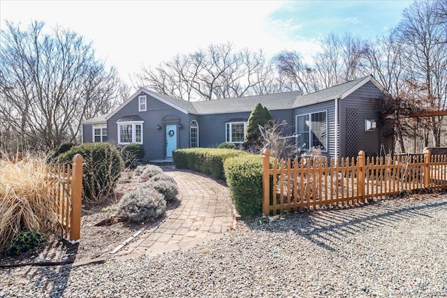 single story home with fence