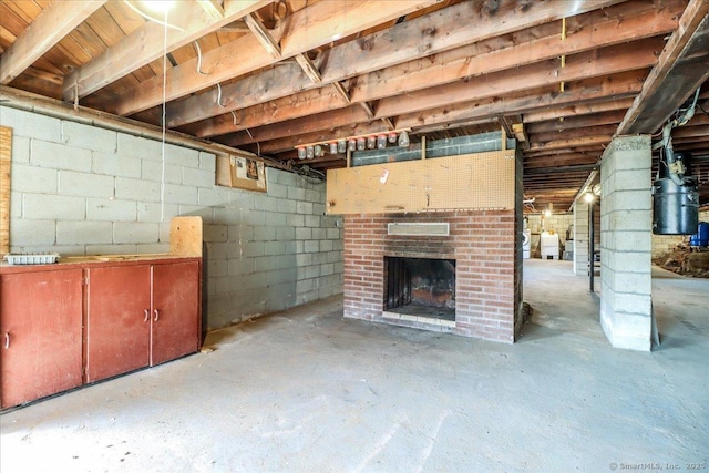 unfinished basement with a fireplace