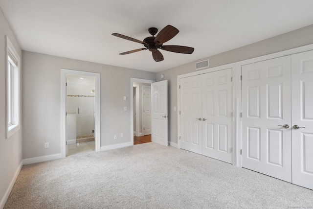 1042 Heritage Vlg Unit A, Southbury, CT 06488 - unfurnished bedroom featuring two closets, carpet floors, baseboards, and connected bathroom