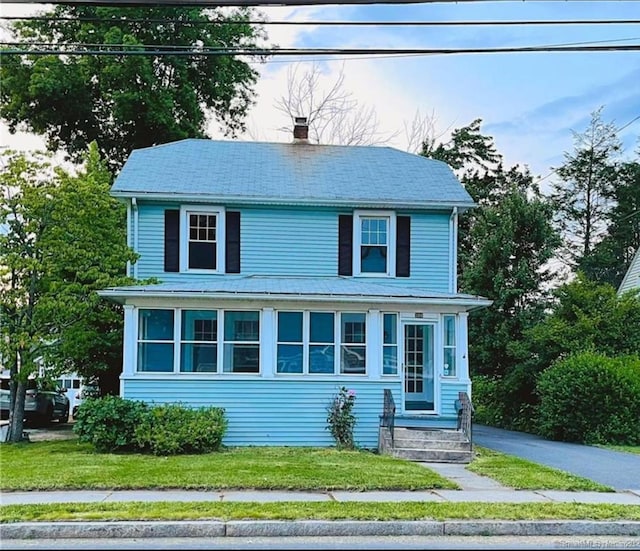 traditional style home with a chimney