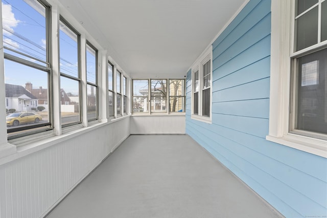 unfurnished sunroom with plenty of natural light