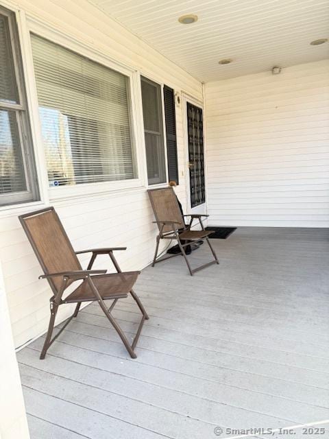 wooden deck featuring covered porch