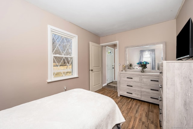 bedroom with wood finished floors