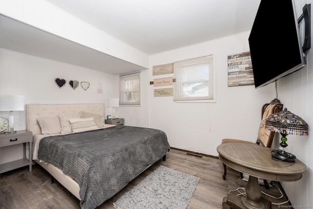 bedroom featuring wood finished floors
