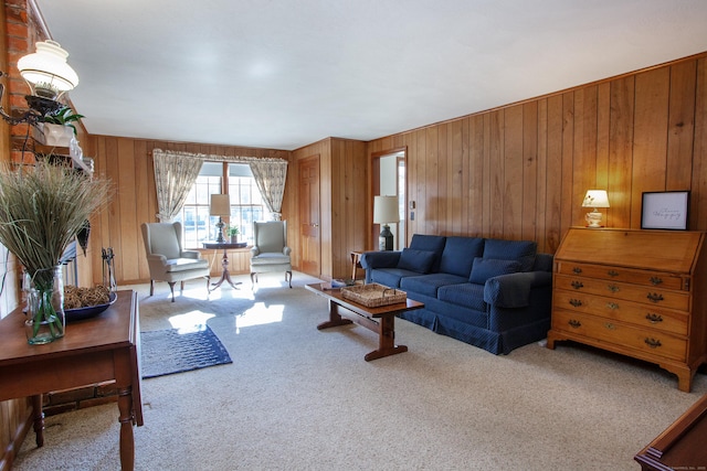 carpeted living room featuring wood walls