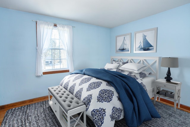 bedroom featuring baseboards