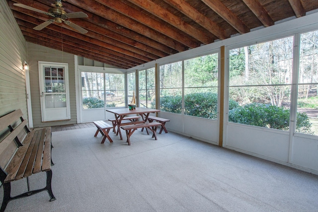 sunroom with a ceiling fan and lofted ceiling