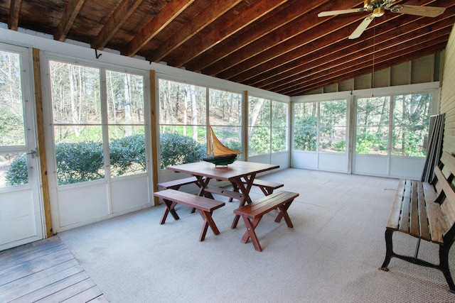 sunroom featuring ceiling fan and vaulted ceiling