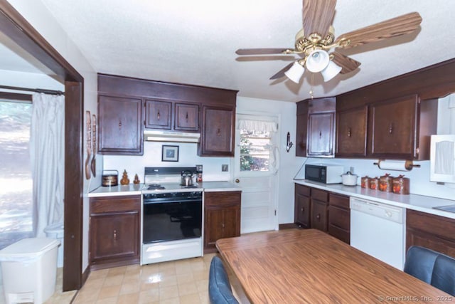 kitchen with black microwave, white dishwasher, range, ceiling fan, and light countertops