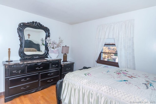 bedroom featuring light wood finished floors