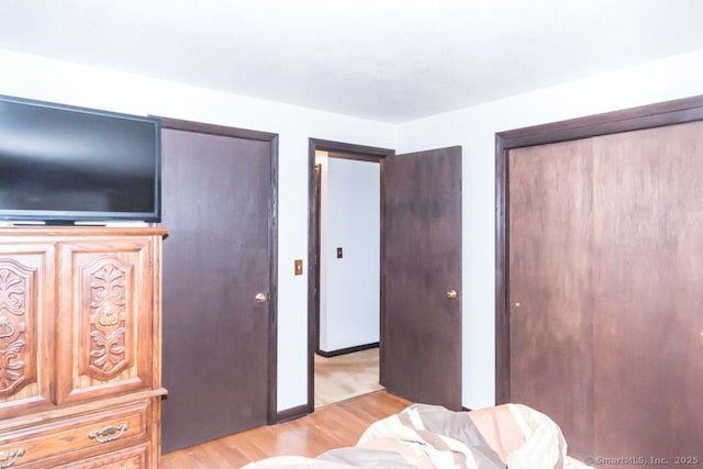 bedroom with light wood-style floors