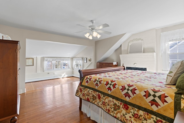 6 Hart Ave, Branford, CT 06405 - bedroom featuring lofted ceiling, a baseboard radiator, ceiling fan, and wood-type flooring