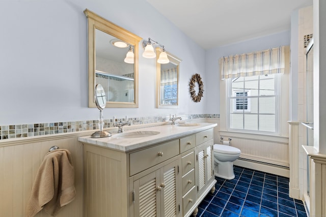 6 Hart Ave, Branford, CT 06405 - bathroom with toilet, a sink, a baseboard heating unit, and wainscoting