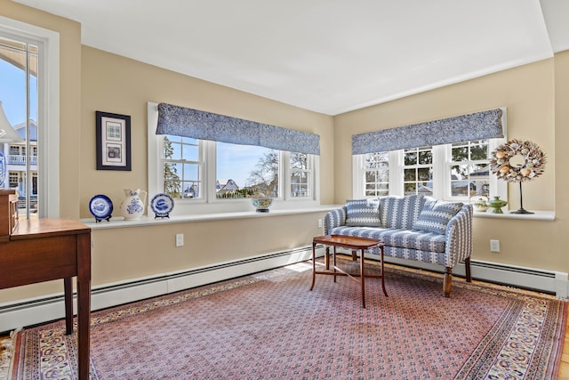 living area with a wealth of natural light and a baseboard radiator