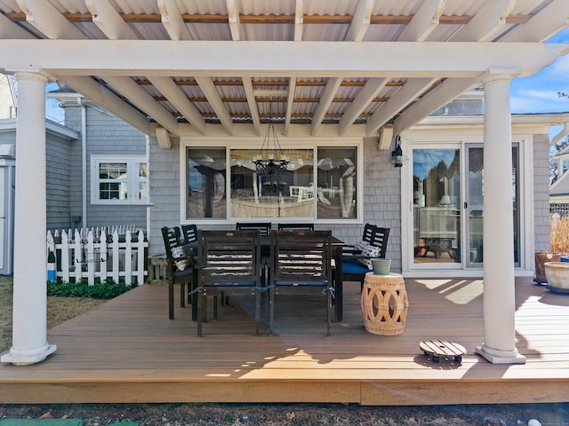 wooden terrace featuring outdoor dining space