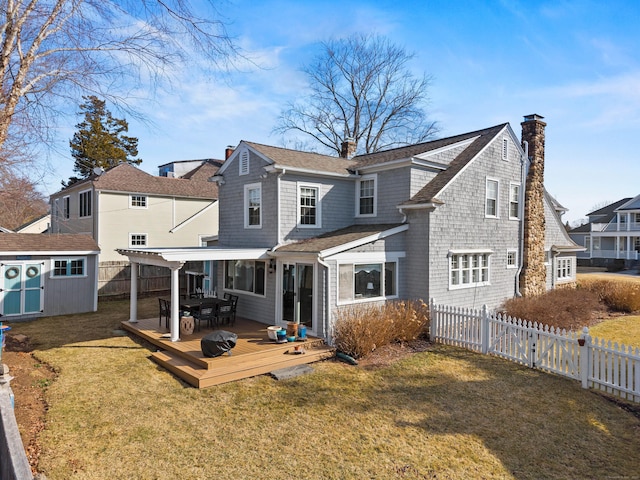 6 Hart Ave, Branford, CT 06405 - rear view of house featuring a chimney, an outdoor structure, a storage shed, a fenced backyard, and a yard