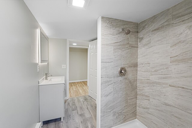 129 Smith Rd, East Haddam, CT 06423 - bathroom featuring wood finished floors, vanity, and tiled shower