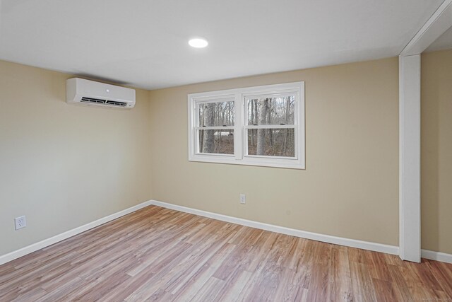 129 Smith Rd, East Haddam, CT 06423 - basement featuring recessed lighting, baseboards, wood finished floors, and a wall unit AC