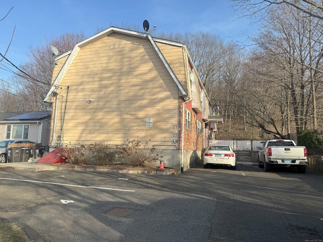 view of side of property with a gambrel roof