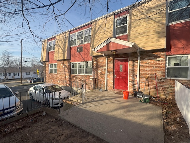 exterior space featuring brick siding