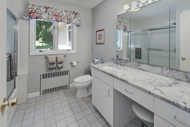 68 Hawthorne Dr, Fairfield, CT 06825 - bathroom with radiator, healthy amount of natural light, vanity, and tile patterned floors