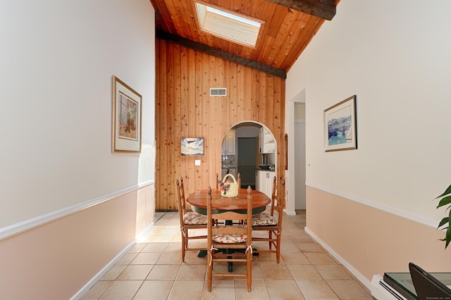 68 Hawthorne Dr, Fairfield, CT 06825 - dining room with high vaulted ceiling, arched walkways, light tile patterned floors, a wood ceiling with exposed beams, and wooden walls