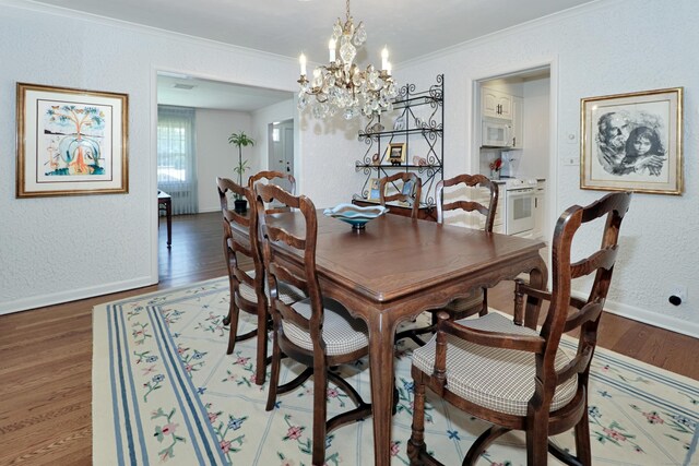 68 Hawthorne Dr, Fairfield, CT 06825 - dining area featuring ornamental molding, wood finished floors, a chandelier, and a textured wall