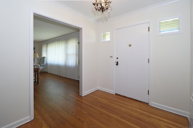 68 Hawthorne Dr, Fairfield, CT 06825 - entrance foyer with healthy amount of natural light, a chandelier, wood finished floors, and crown molding
