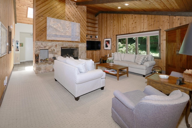 68 Hawthorne Dr, Fairfield, CT 06825 - living area featuring wood walls, a wooden ceiling with exposed beams, high vaulted ceiling, light colored carpet, and a stone fireplace