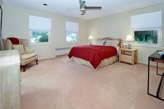 68 Hawthorne Dr, Fairfield, CT 06825 - bedroom with radiator, light carpet, and a ceiling fan