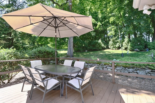 68 Hawthorne Dr, Fairfield, CT 06825 - wooden deck featuring outdoor dining space and a yard