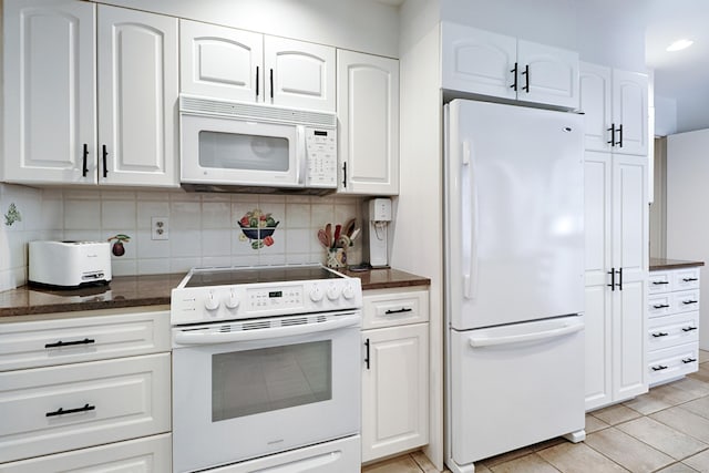 68 Hawthorne Dr, Fairfield, CT 06825 - kitchen with white appliances, light tile patterned flooring, and white cabinets
