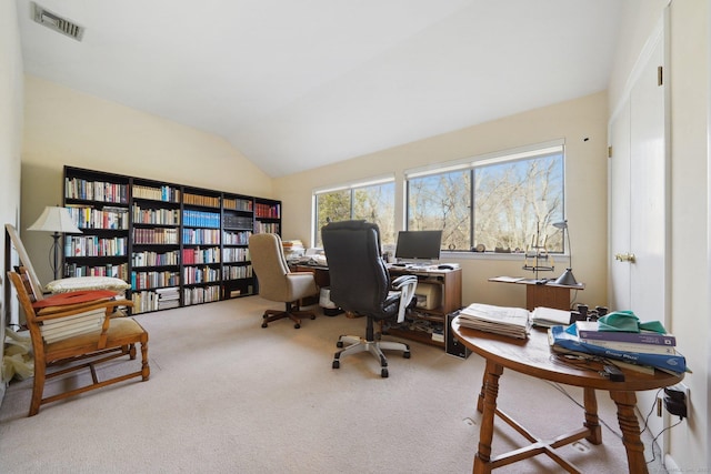 office space with vaulted ceiling and carpet
