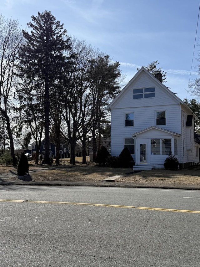 view of front of property featuring a chimney