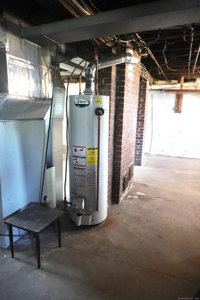 utility room featuring gas water heater